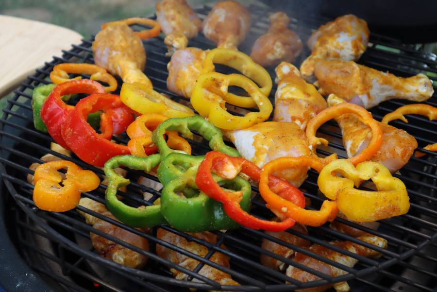 Grilling the chicken and peppers